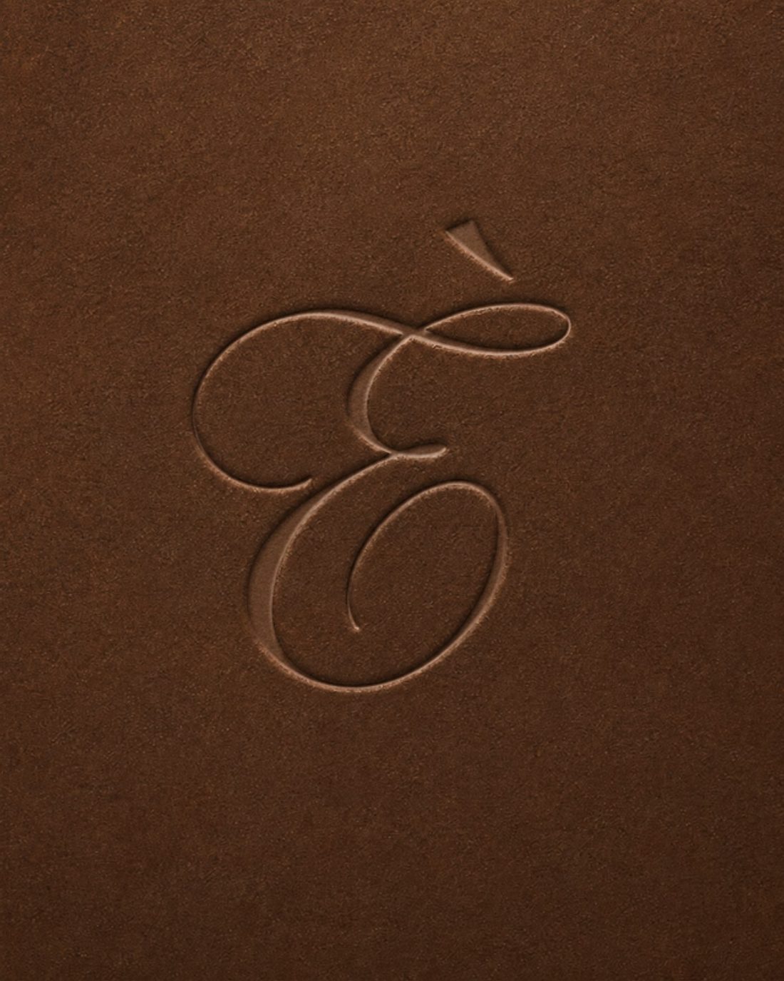 The Erneè monogram embossed in leather
